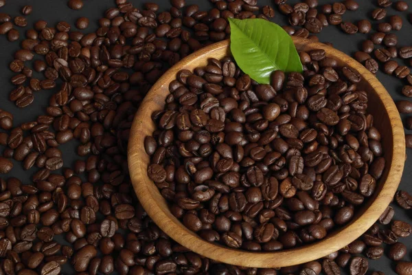 aromatic coffee beans with coffee leaf
