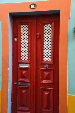 Santa Maria Street in Funchal Madeira. This is a narrow street in the old town of Funchal. It is full of Restaurants and cafes, but is chiefly known for its painted doors. These works of art attract thousands of visitors