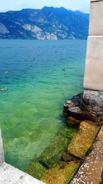 Malcesine is one of the lovely towns on Lake Garda in Northern Italy. It has its own castle guarding the town,its harbour  and its ancient narrow streets. Malcesine is so stunning and peaceful