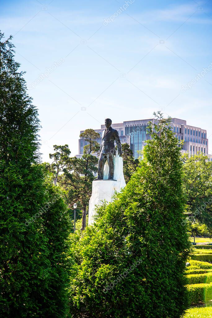 Baton Rouge capital city of Louisiana This is the Louisiana State Capital Building in Baton Rouge.This Statue in the Garden is of the radical populist politician Senator Huey Long who was assassinated in 1935 in the Louisiana State Capital Building 