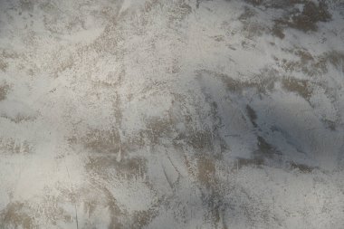 Duvardaki çimento ve beyaz boyanın soyut dokusu.