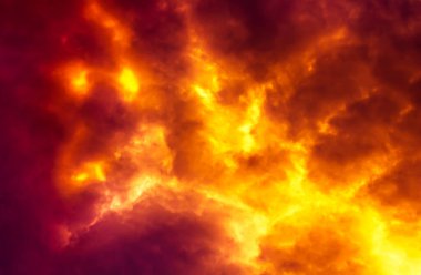 Flame are burning on clouds in dark red sky clipart