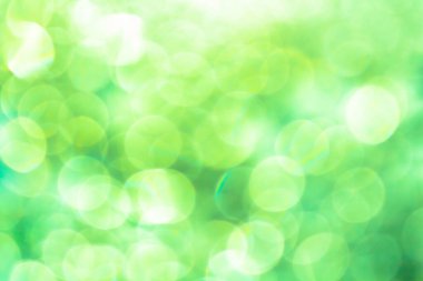 Bulanık arkaplanda yeşil bulanık bokeh ışığı