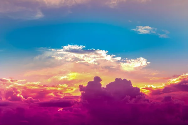red purple clouds in blue sky with orange and yellow sunset light,colorful fantasy sky