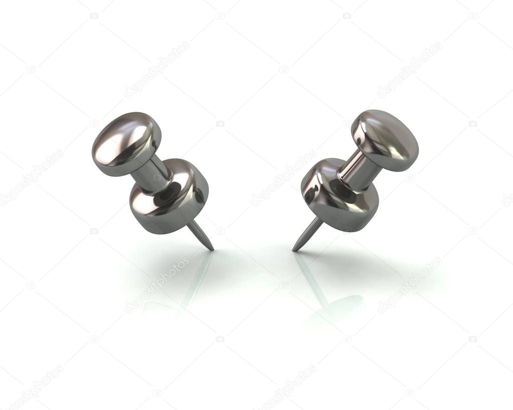 Two silver push pins