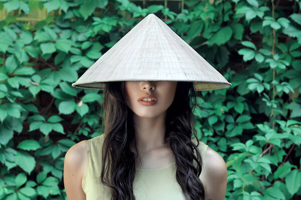 Portrait of a girl in a straw hat