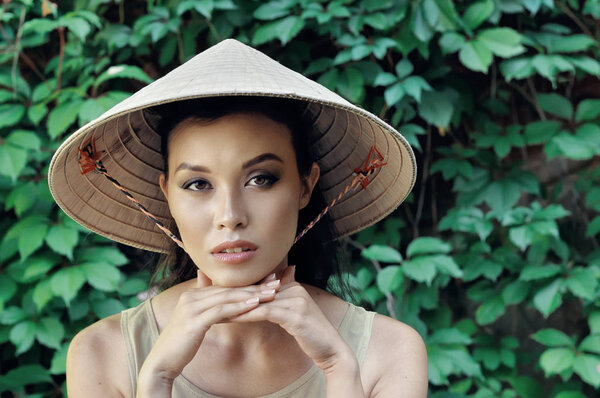 Portrait of a girl in a straw hat