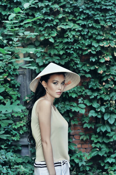 Portrait of a girl in a straw hat