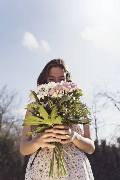 A loved girl holds flowers