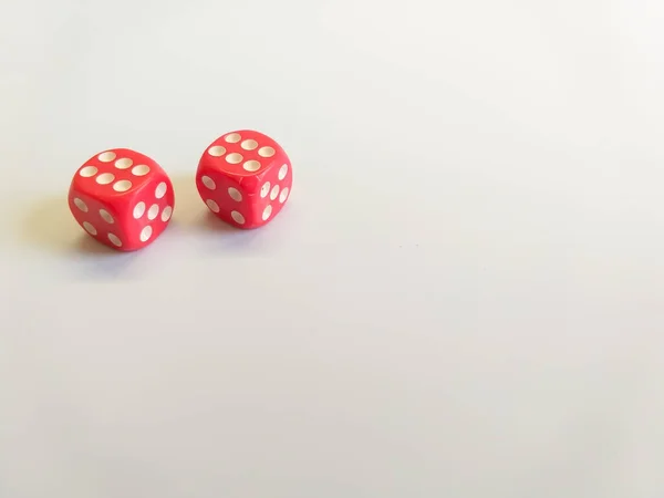 Dice of red color with white dots with a successful combination are isolated on a white background. Great space for text. Good luck in the game. Victory concept. Gambling concept