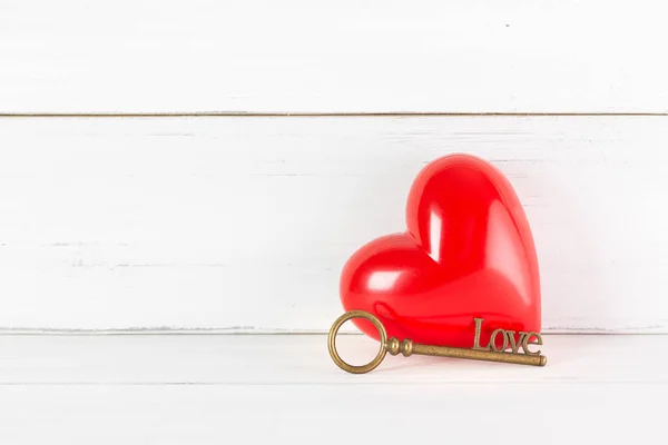 Red Heart with Antique Key on white wood background. Success Lov — 스톡 사진