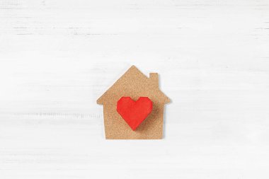 Red Paper Heart with House shaped on white wood background. Happ