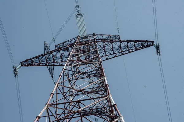 electric transmission lines against the sky bottom view