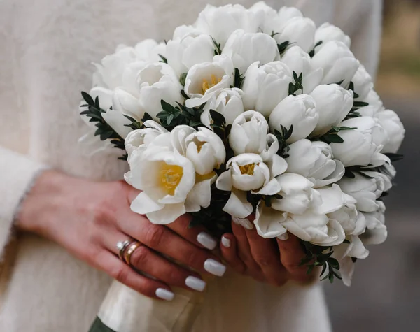 beautiful wedding bouquet in the hands of the bride. Wedding. Wedding decorations. Close-up
