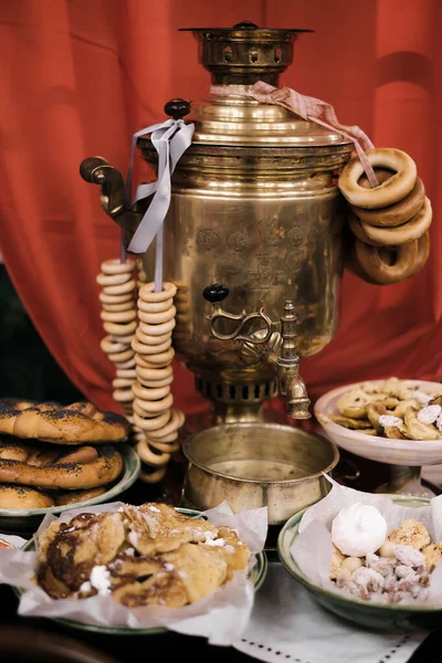 Russian samovar with sweets in Moscow at the fair, Maslenitsa