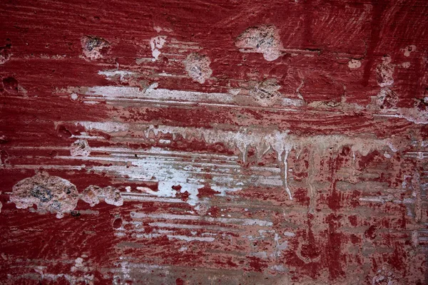 Old Red painted Wall abstract texture background. Scratch wall texture. Old red and white wall texture.
