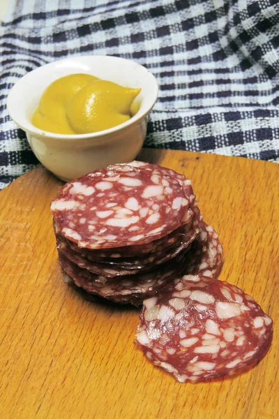 Dry sausage cut in slices — Stock Photo, Image