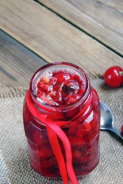 Cherry jam and berries — Stock Photo, Image