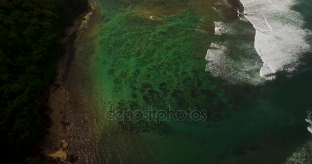 Aerial drone 4k footage of ocean waves breaking before the shore. Bali, Indonesia — Stock Video