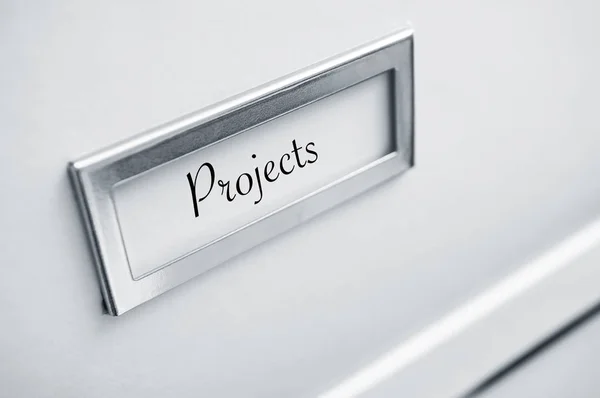 Archive cardboard with sticker with word "Projects" — Stock Photo, Image