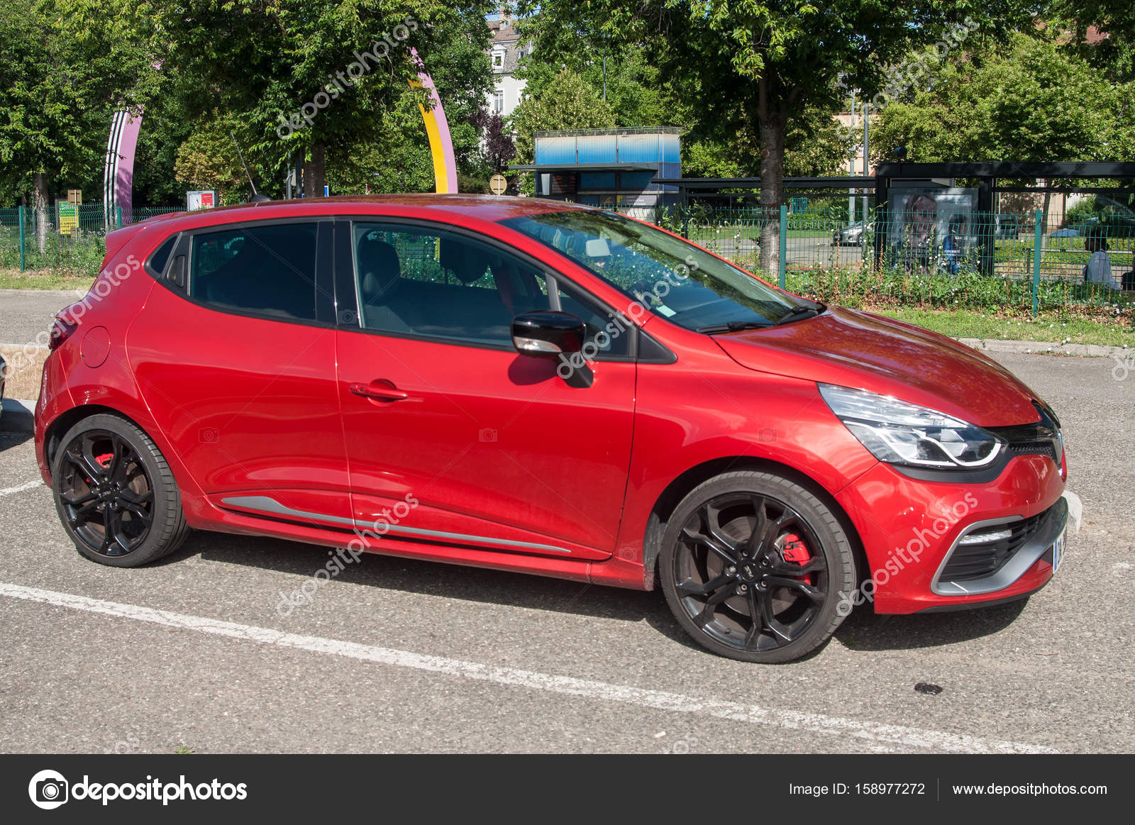 Red Renault Clio RS sport parked in the street – Stock Editorial Photo © NeydtStock