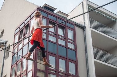 the artist Johanne Humblet tightrope walker performance during four hours in Mulhouse clipart