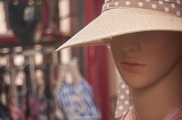 Mannequin with hat in fashion store for women Royalty Free Stock Photos