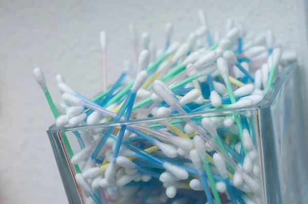 cotton swabs in transparent glass