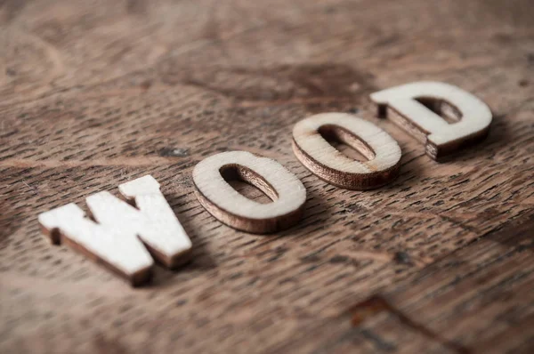 Woord van de concept in houten letters op houten tafel - hout — Stockfoto