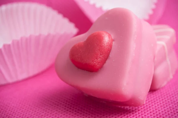 pink shaped heart pastry on pink background