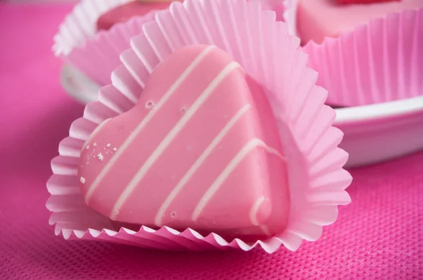 Pink shaped heart pastry on pink background — Stock Photo, Image