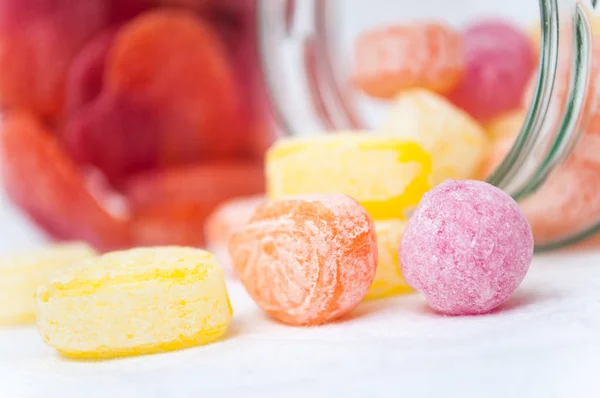 traditional candies in transparent glass container