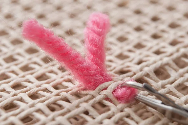Creative leisure with pink wool wire on canvas Royalty Free Stock Images
