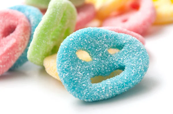 Acidulous candies in shaped smiley on white background — Stock Photo, Image