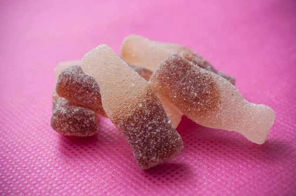 Cacidulous cola candies on pink background — Stock Photo, Image