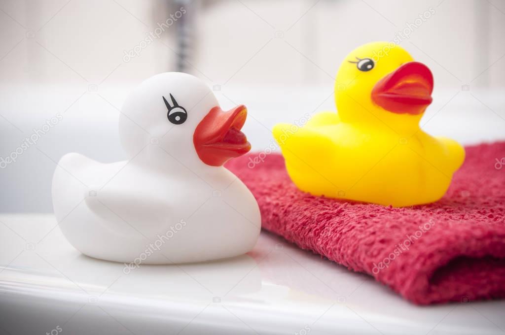  Yellow and white rubber duck toy on bath