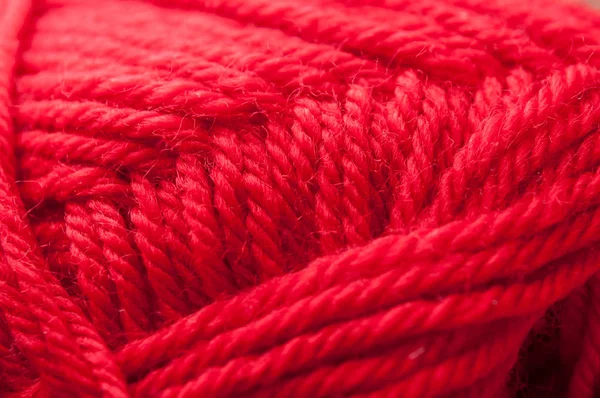 Ball of red wool yarn texture