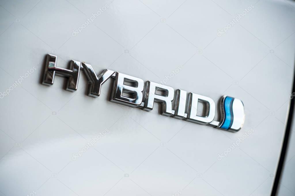 Mulhouse - France - 9 April 2018 - hybrid logo on white Toyota Prius car