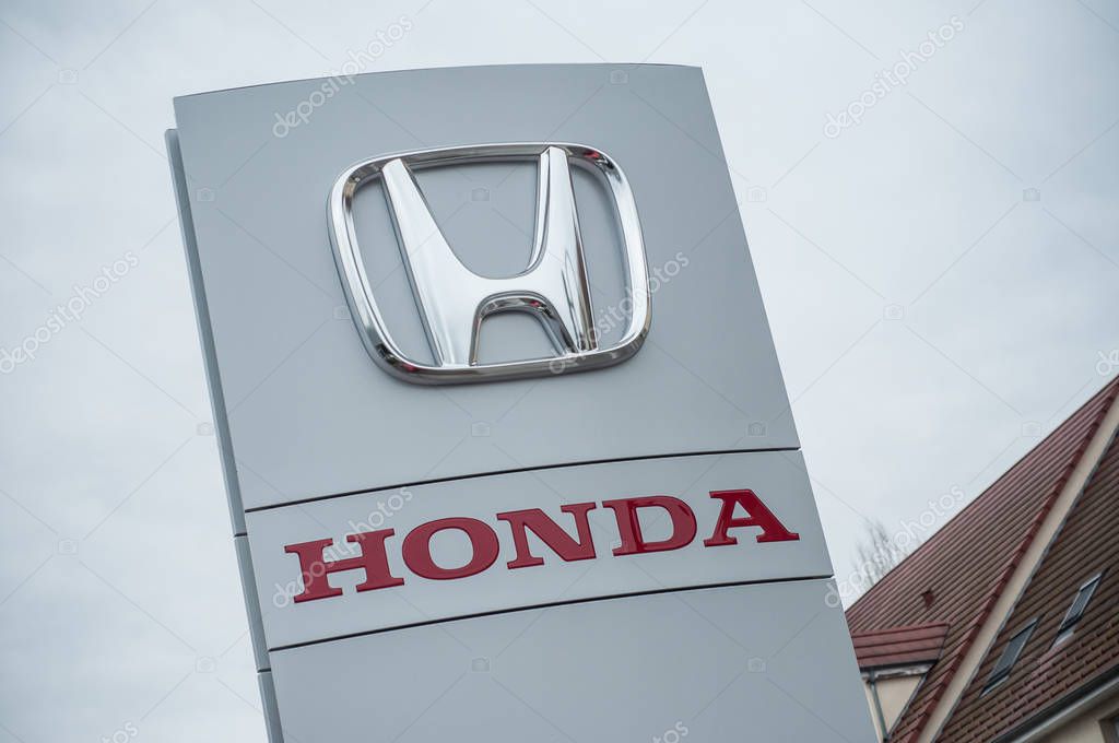 Mulhouse - France - 10 April 2018 - closeup of Honda Logo sign on Store front, Honda is a Japanese brand multinational company which currently produces automotive