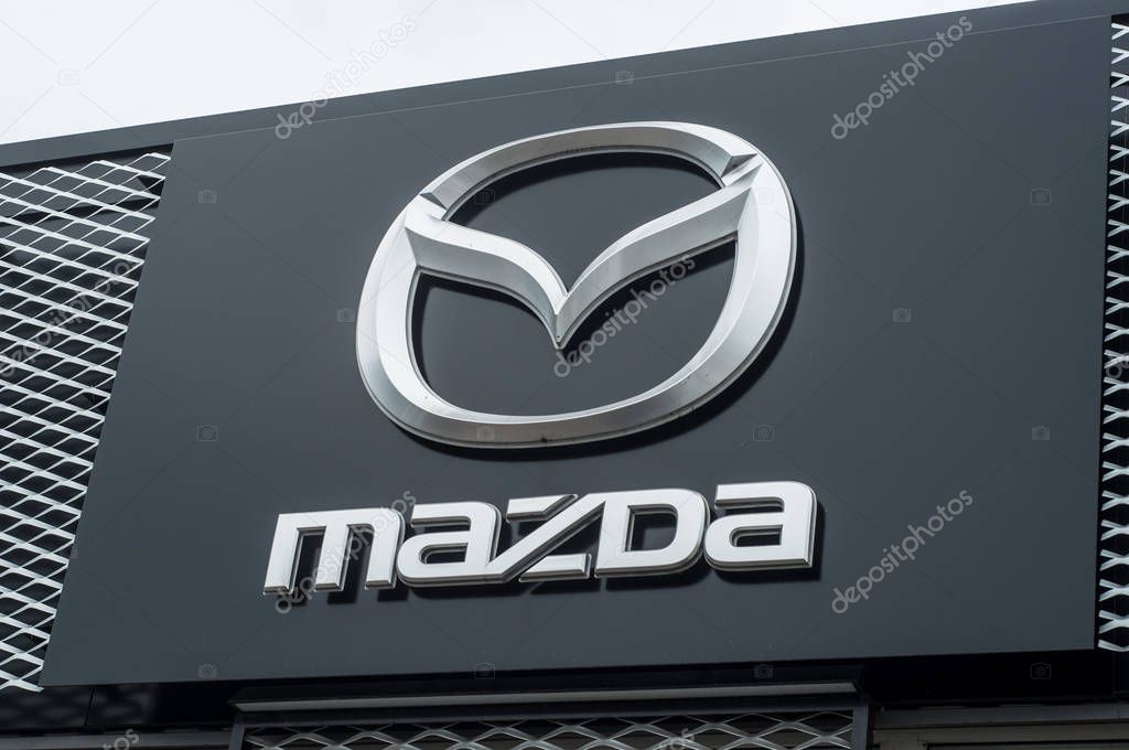 Mulhouse - France - 10 April 2018 - retail of Mazda logo on store front, Mazda is a japanese brand multinational company which currently produces automotive