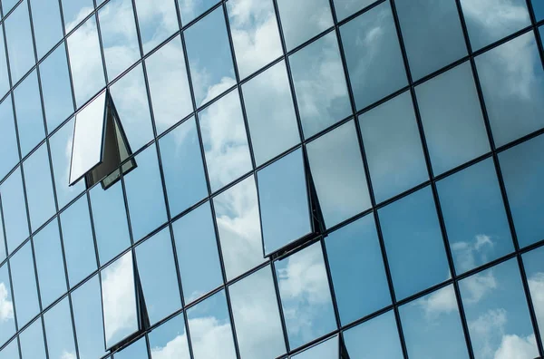 Modern building with glass reflection of clouds — Stock Photo, Image