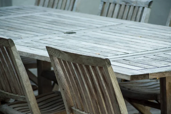 Teak garden furniture on a wooden terrace in spring — Stock Photo, Image