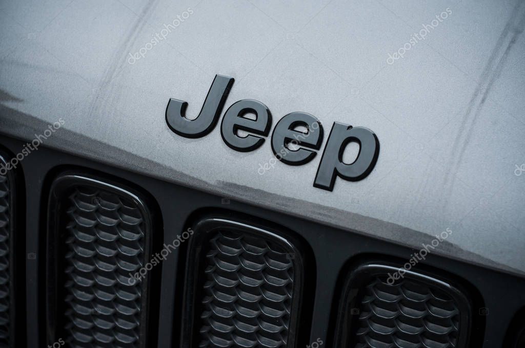 Mulhouse - France - 8 November 2019 - Closeup of Jeep logo on black car front parked in the street
