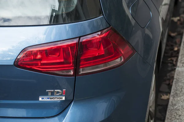 Rear light and sign on blue Volkswagen Goft TDI parked in the street — Stock Photo, Image