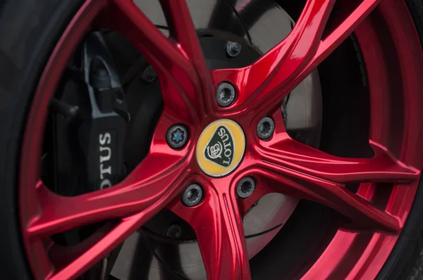 Black brake on red wheel of Lotus Exige sport car parked in the street — ストック写真