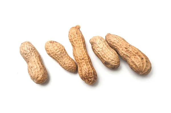 Closeup of organic peanuts on top view on white background — Stock Photo, Image