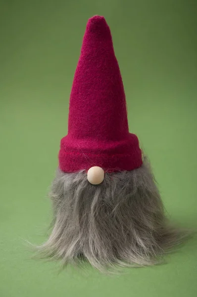 Closeup of christmas gnome on green background — Stock Photo, Image