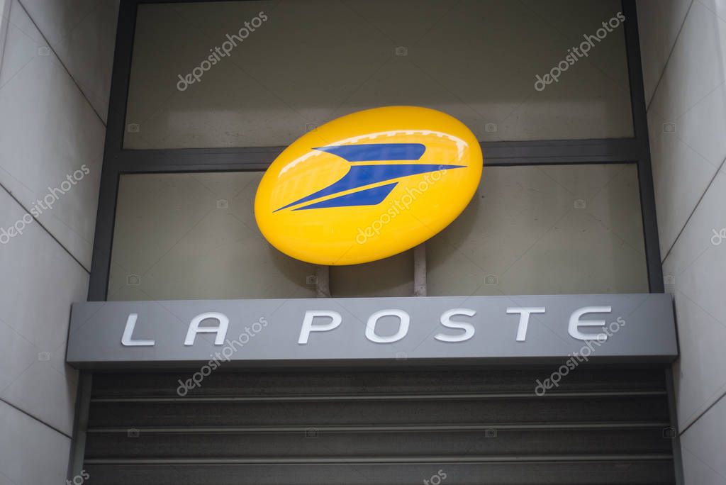 Strasbourg - France - 1 January 2020 -  Closeup of the french post logo on agency facade