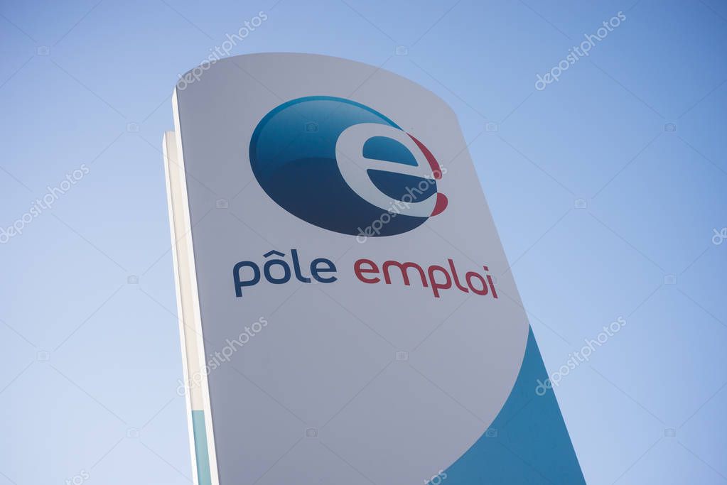 Mulhouse - France - 7 January 2020 - Closeup of Pole emploi signboard on blue sky background, pole emploi is the french agency of job research