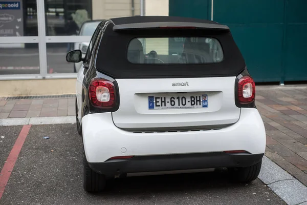 Rear view of white Smart car parked in the street — 스톡 사진